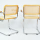 A pair of chairs with armrests, 1970s