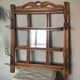 Art Deco wall-mounted coat rack in oak, early 20th century. Beveled central mirror