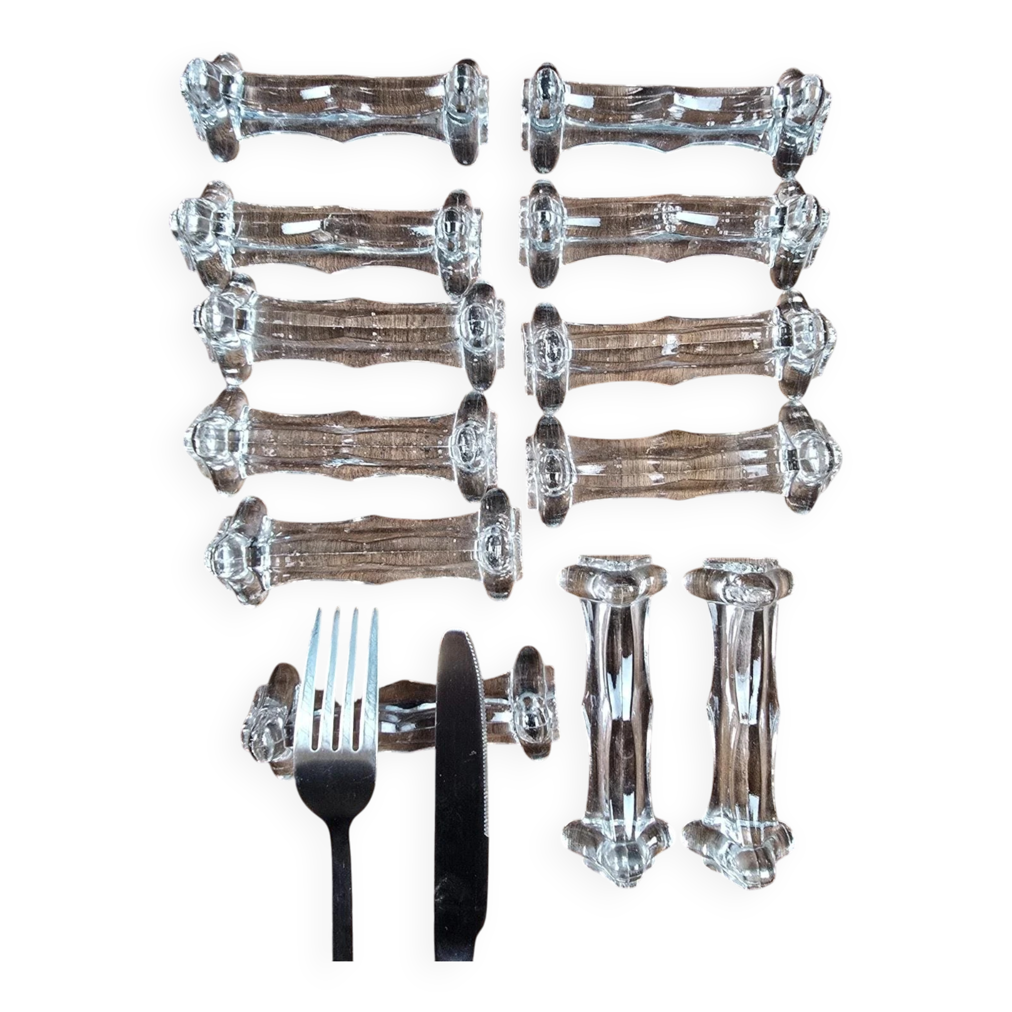 Set of 12 antique knife and fork rests in thick transparent glass.