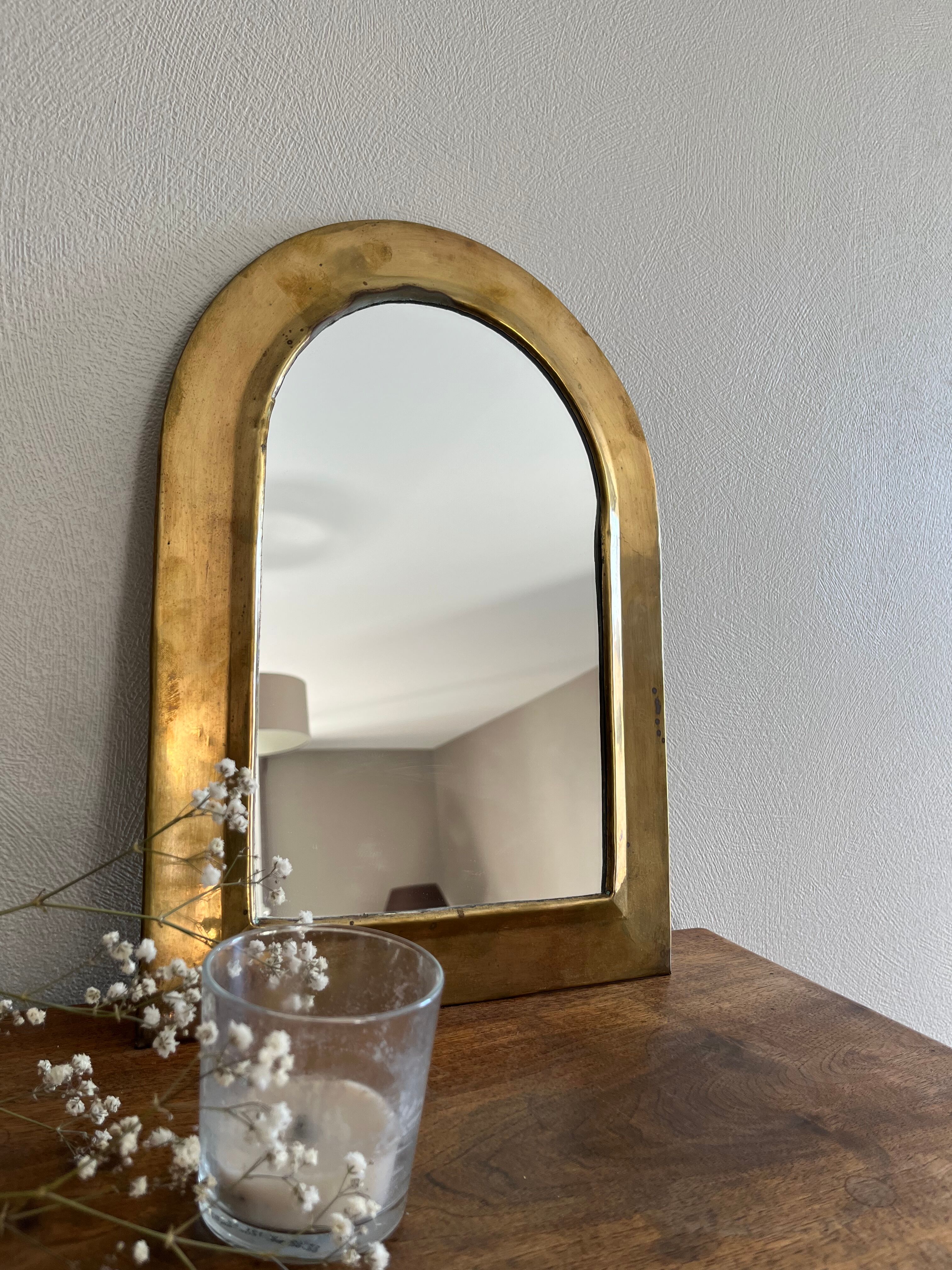 Brass half-moon mirror