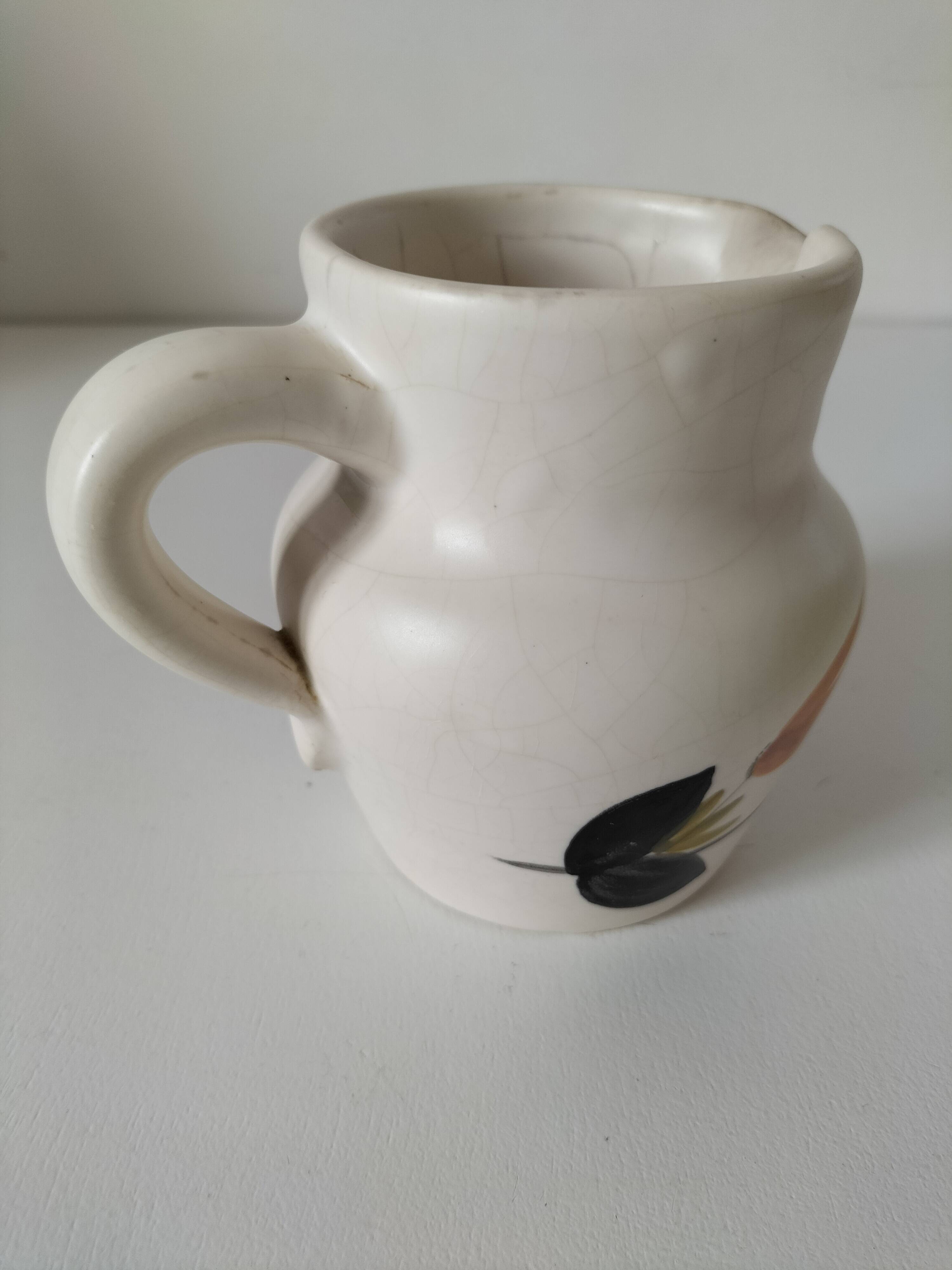 Vintage Marais pottery pitcher with orange floral decoration
