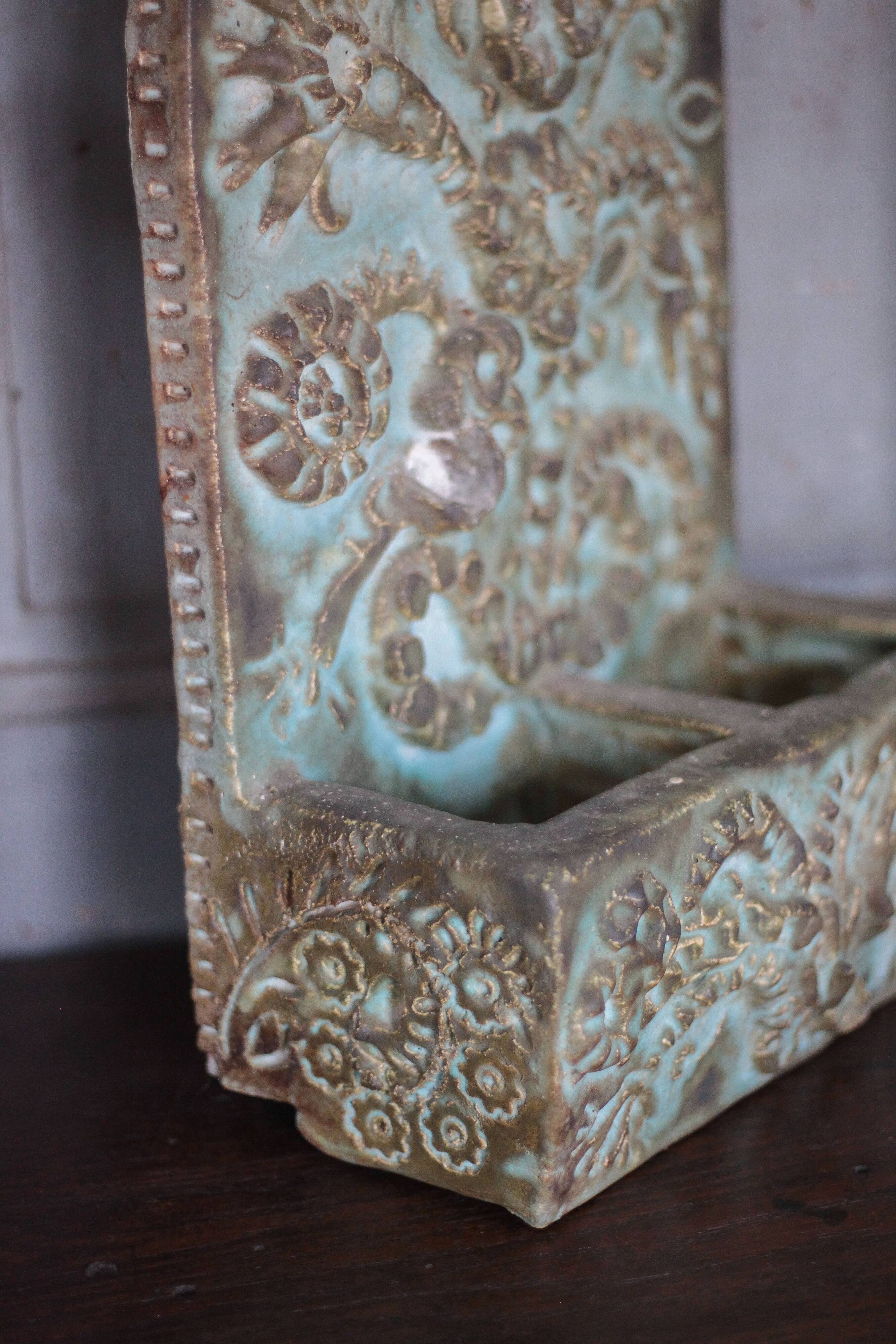 Pair of signed ceramic wall planters, pot cover