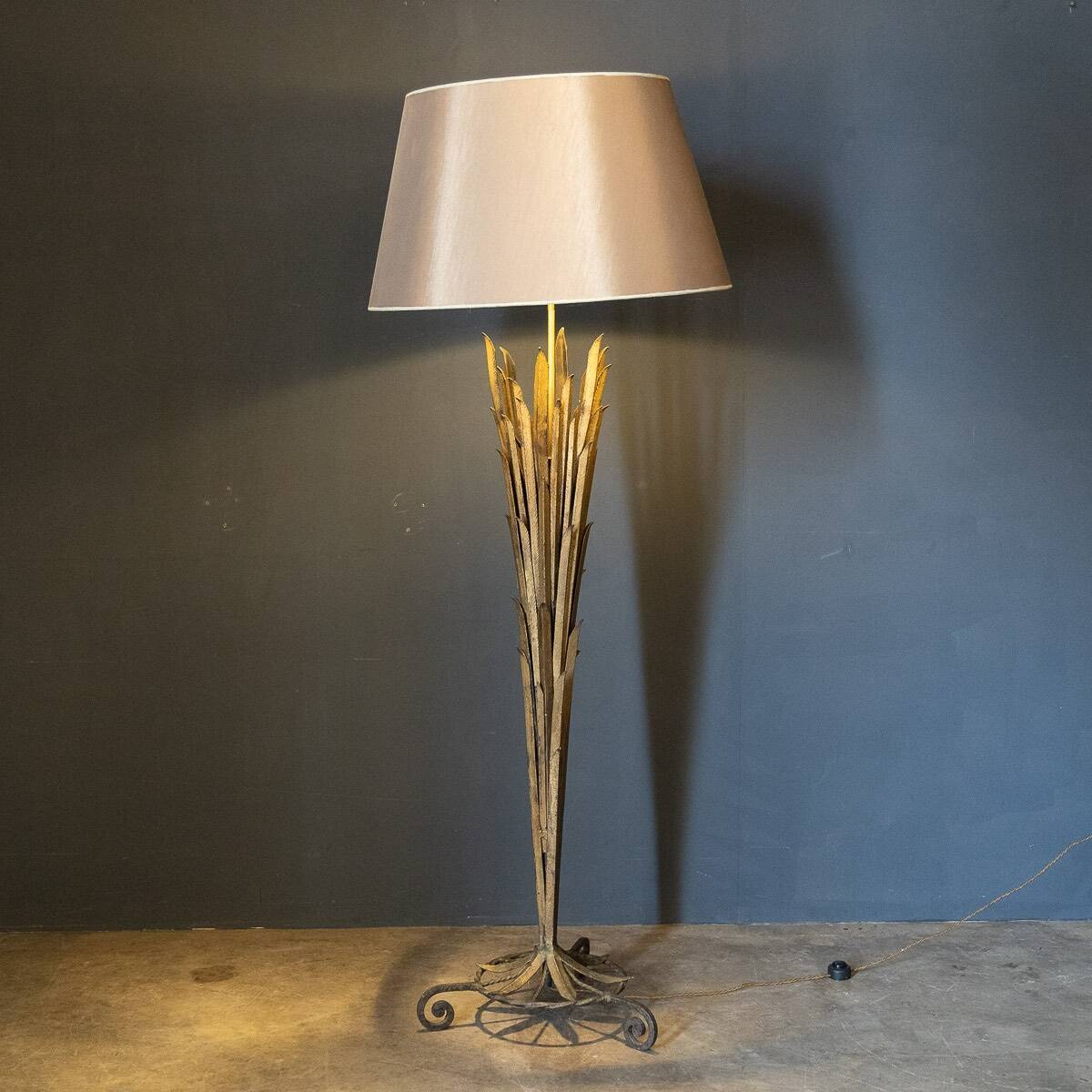 A french gilt wrought iron floor lamp, attributed to maison bagues c.1970
