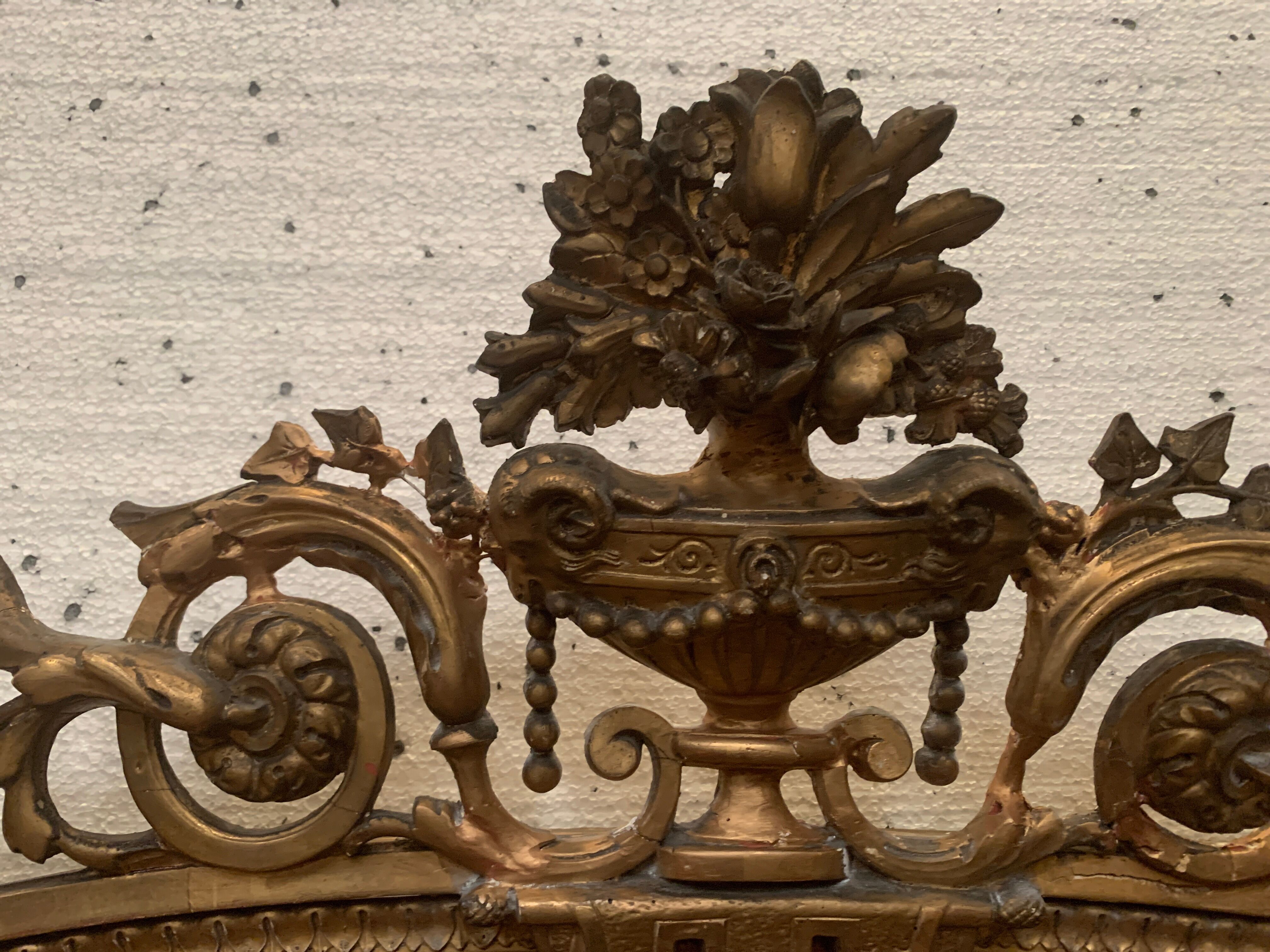 Louis XVI style mirror in wood and gilded stucco XIX century