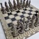 Vintage chess set in patinated metal alloy with a 39 cm chessboard from the 1980s.