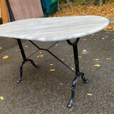 Table de bistrot marbre ovale et acier noire pétrole 4 couverts 140cm