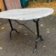 Oval bistro table in marble and petrol black steel, seats 4, 140cm