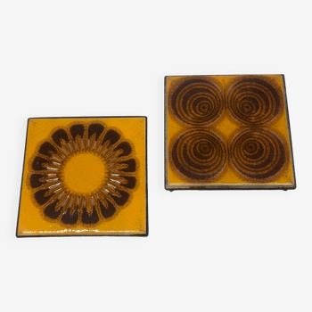 Pair of vintage orange ceramic trivets