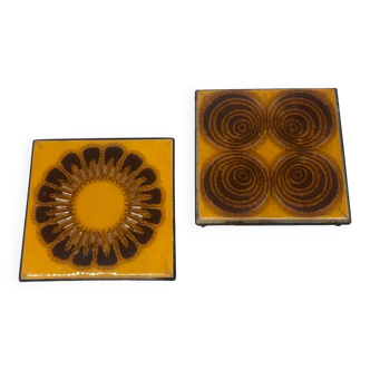 Pair of vintage orange ceramic trivets