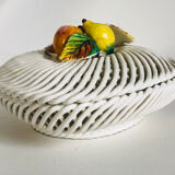 Covered basket in woven ceramic and fruit slip.