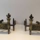 Pair of Empire Period Chenets in Chiselled Bronze with Torches and Leaf Frieze