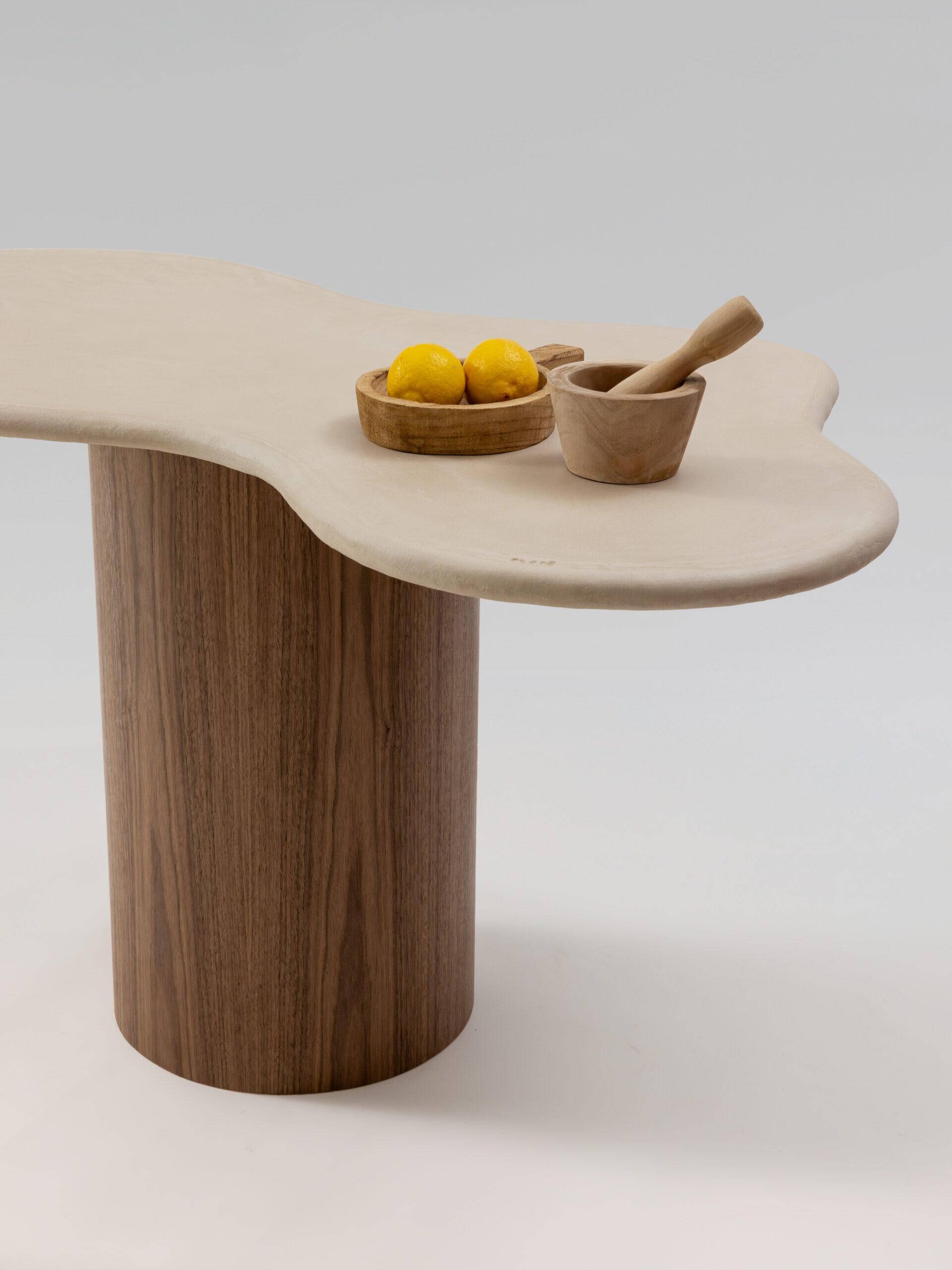 Teā dining table with walnut legs