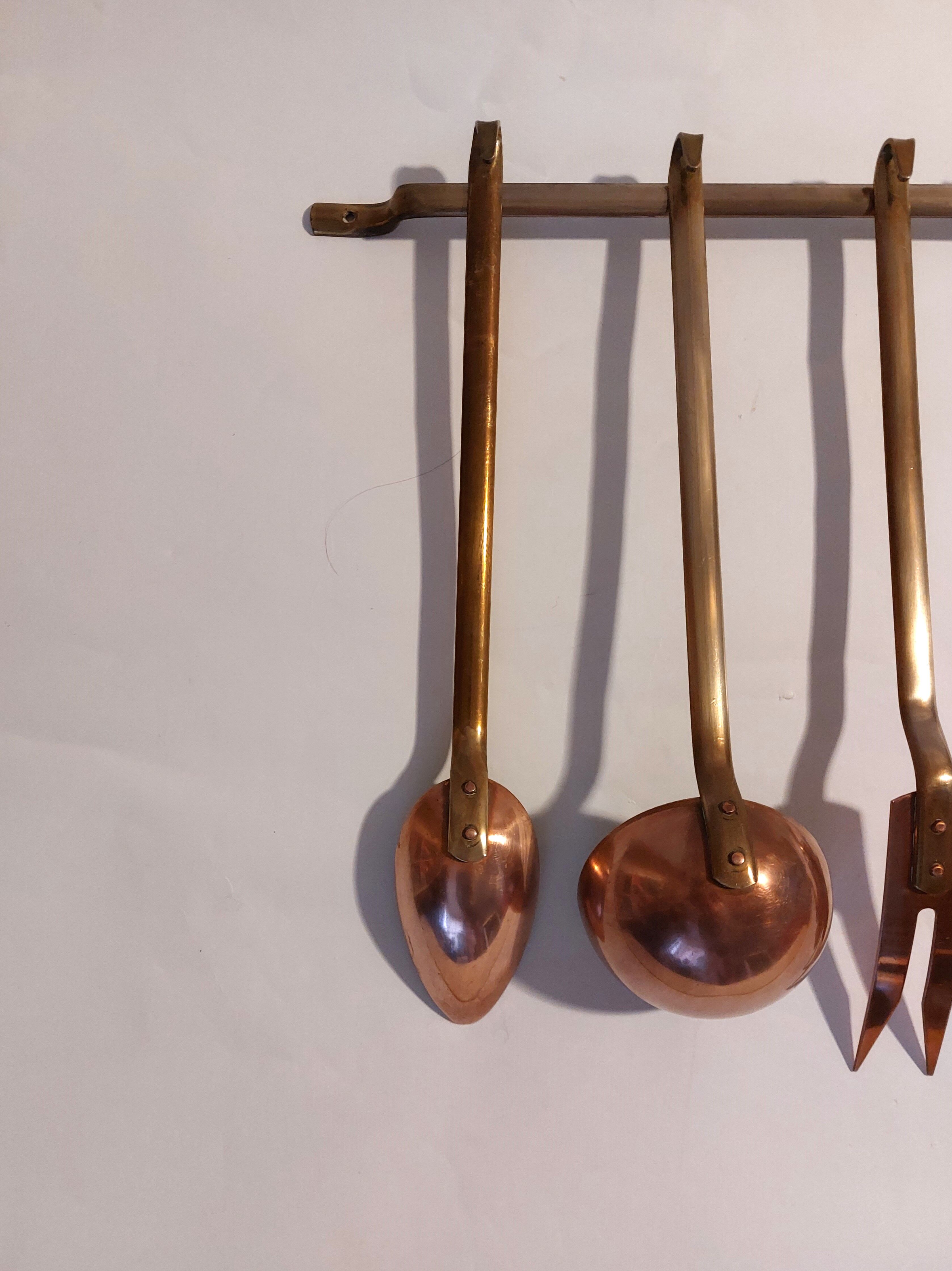 Vintage copper and brass kitchen utensils.