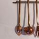 Vintage copper and brass kitchen utensils.