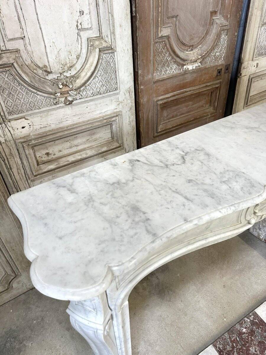Large white marble fireplace in Louis XV style, 19th century.