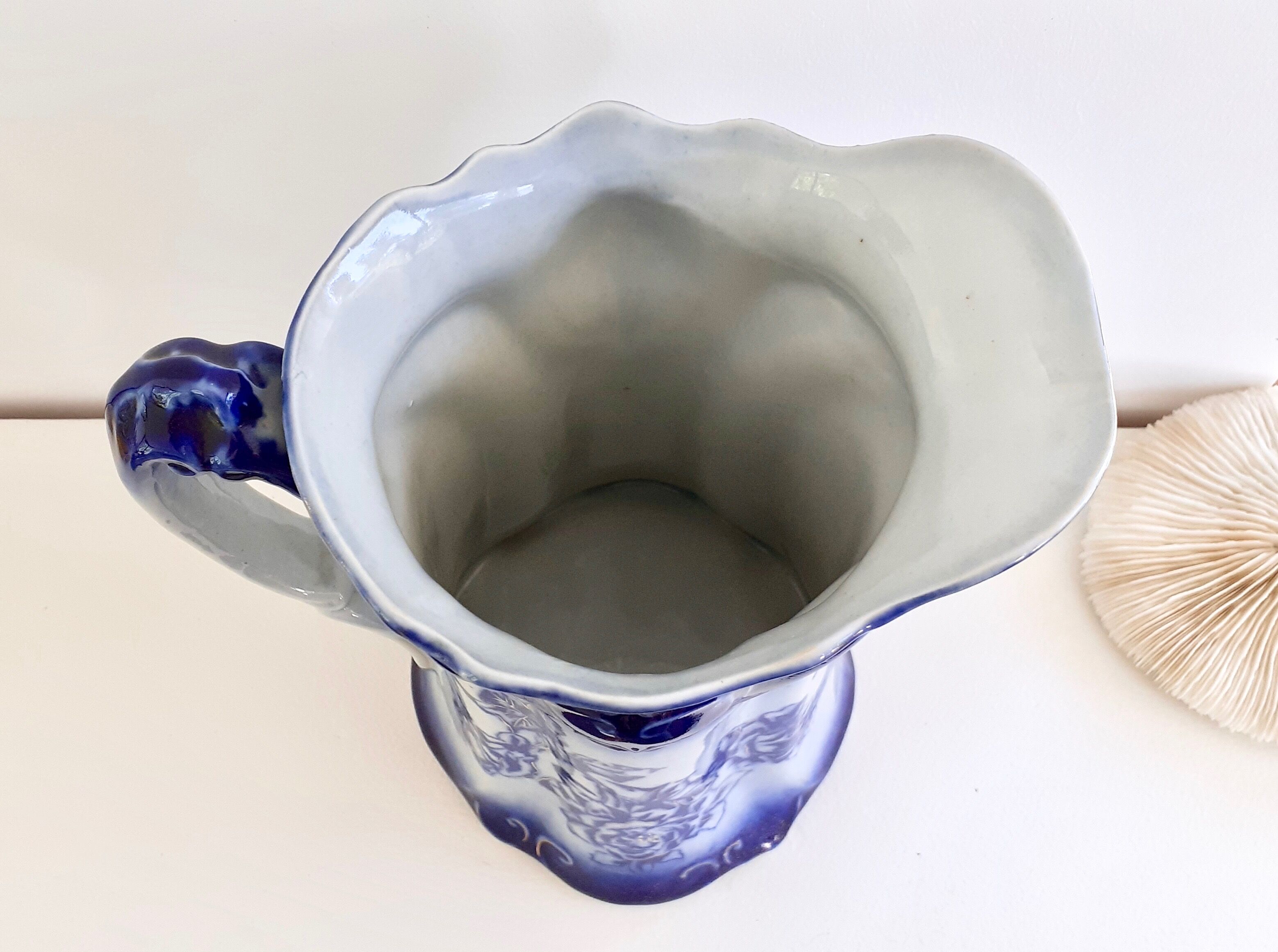 Old pitcher in blue flow, T.Rathbone, England circa 1910