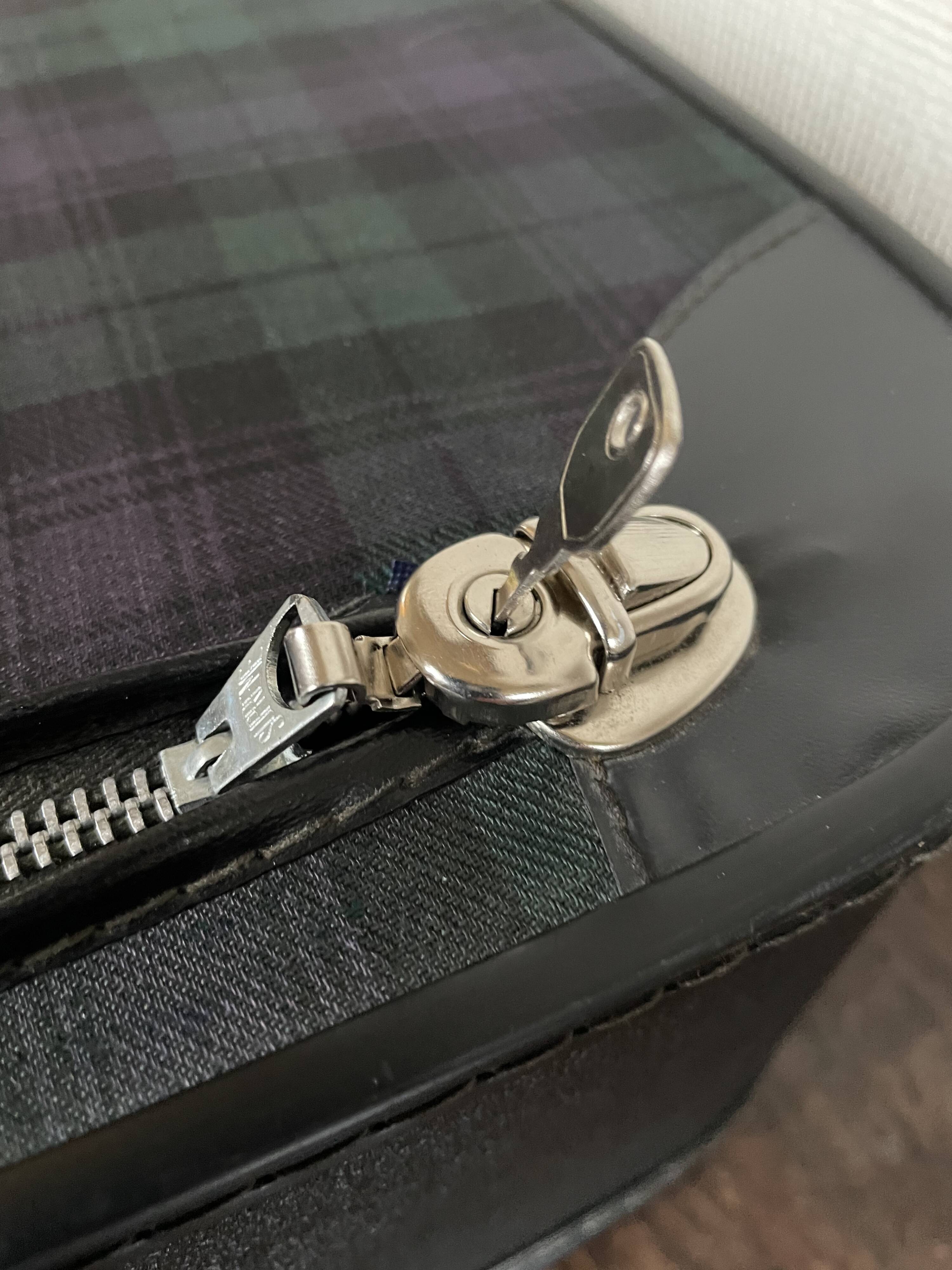 Tartan check suitcase