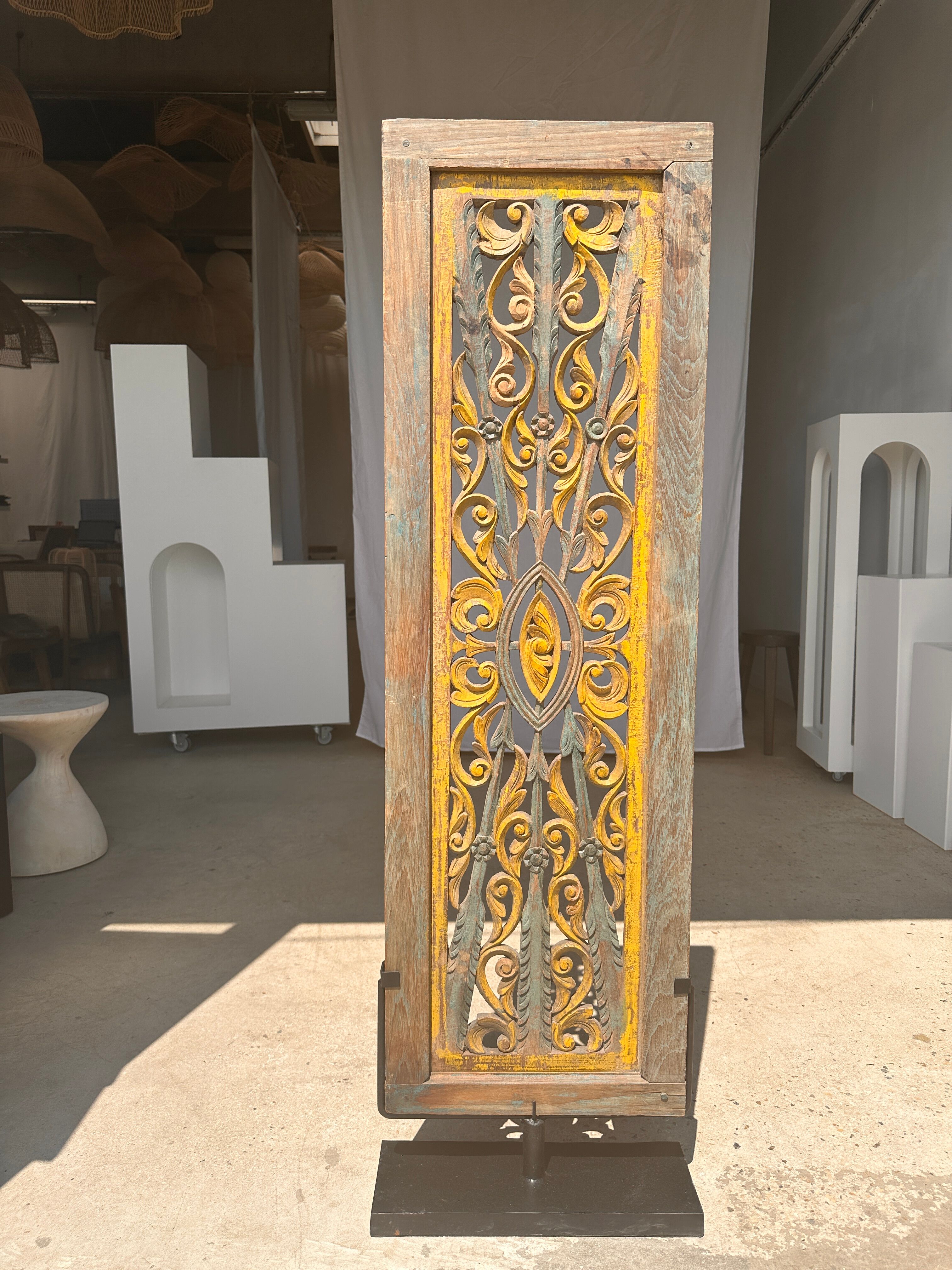 Rectangular Indonesian construction element with blue and yellow plant in carved wood