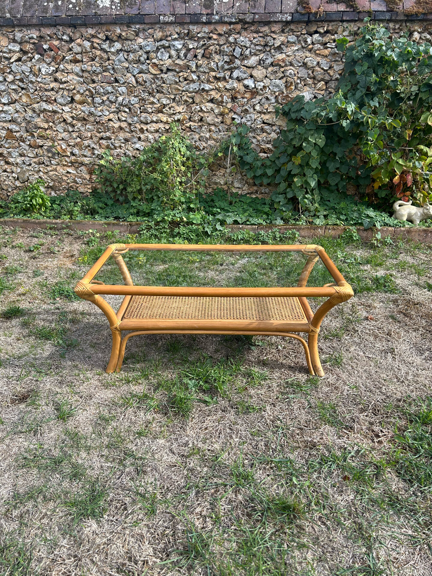 Light rattan coffee table with vintage 1970s caning.