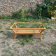 Light rattan coffee table with vintage 1970s caning.