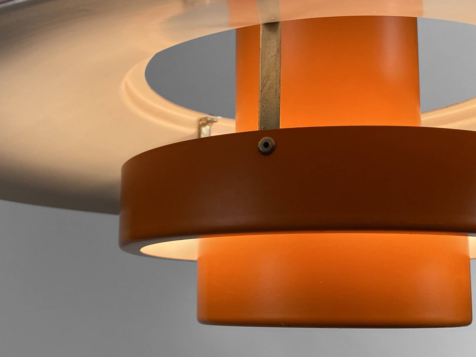 Pendant light "Falcon" two tone orange by Andreas Hansen for Fog & Mørup. Denmark 1960s.