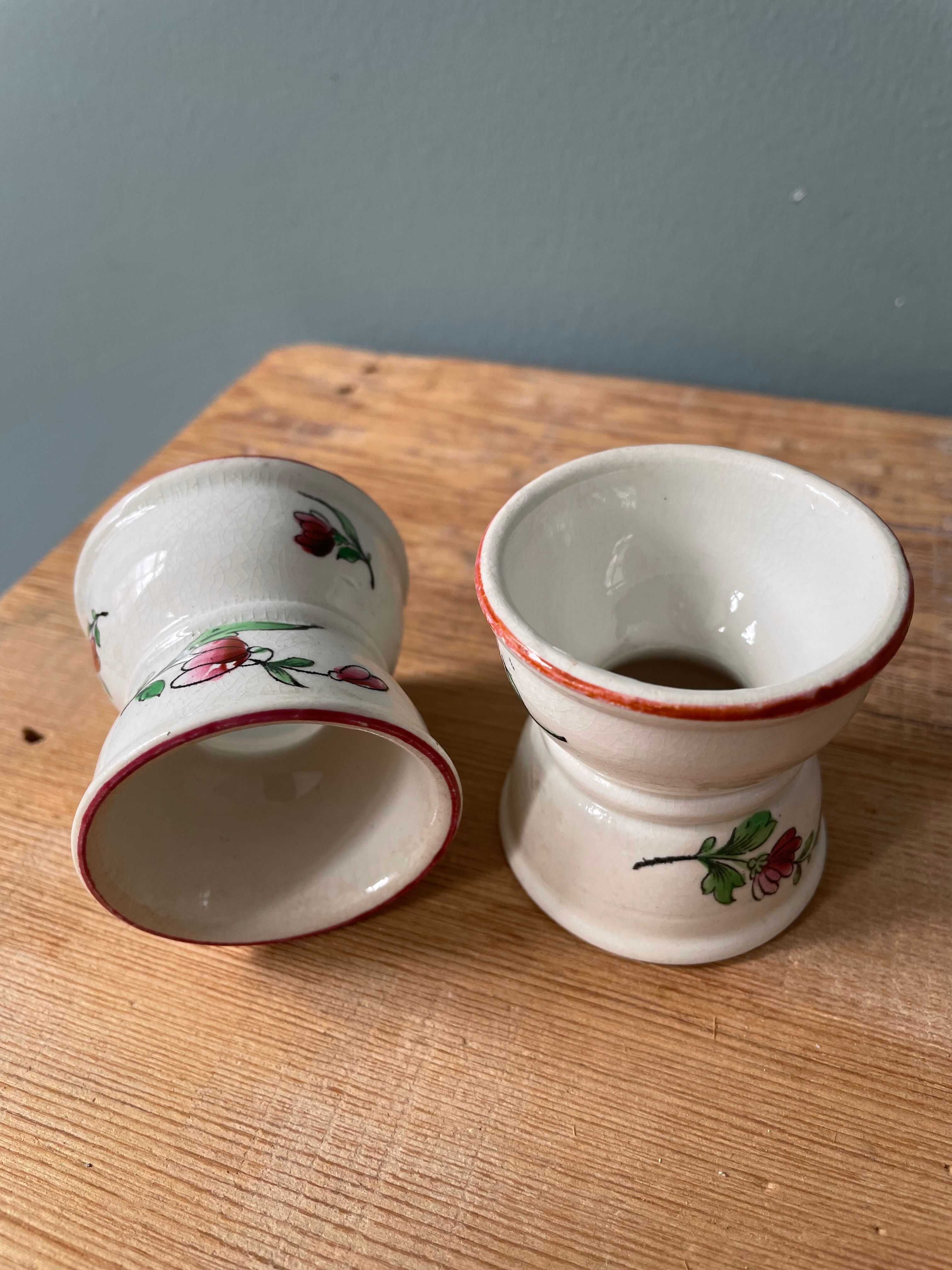 Pair of diabolo eggcups in ancient earthenware