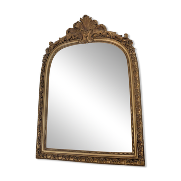 Decorative mirror with mouldings and a pediment.