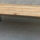 Wooden coffee table with pin legs
