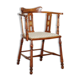 Edwardian walnut chair with a curved backrest and mother-of-pearl inlay in the Arts and Crafts style.