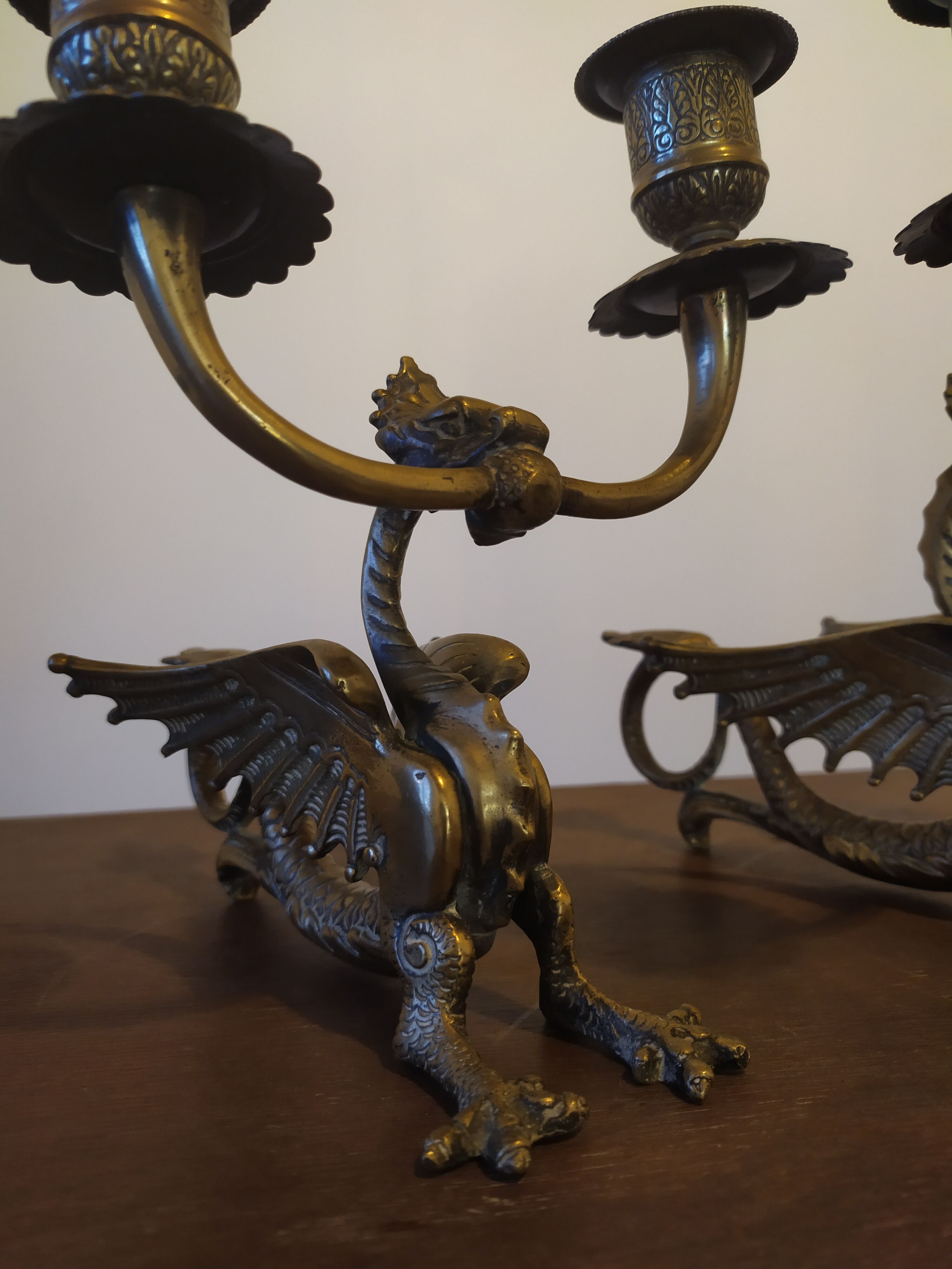 Pair of candlesticks with old chimera dragons hands