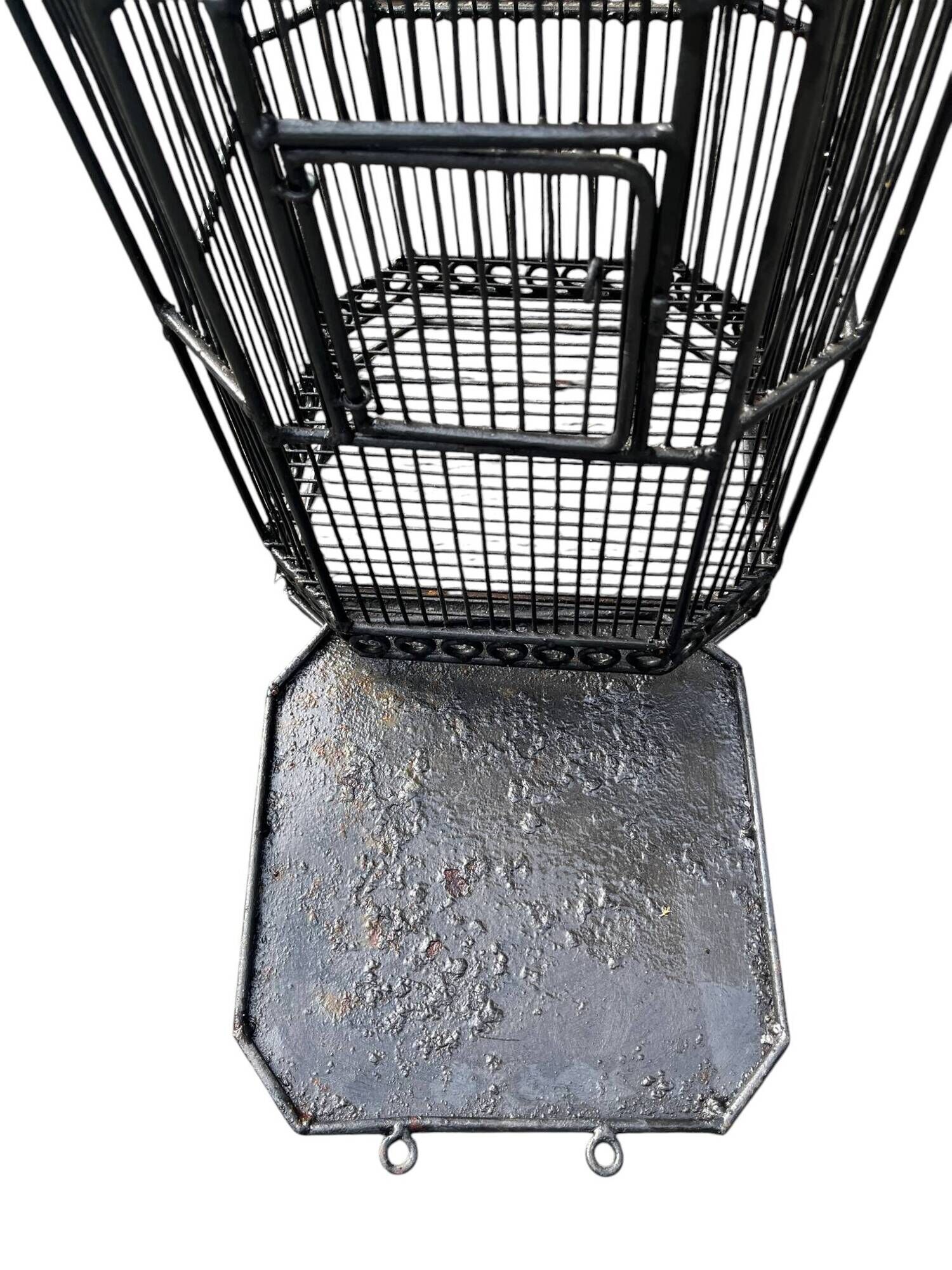 Old black metal birdcage from the early 20th century.