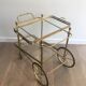 Neoclassical brass rolling table from Maison Baguès