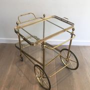 Neoclassical brass rolling table from Maison Baguès