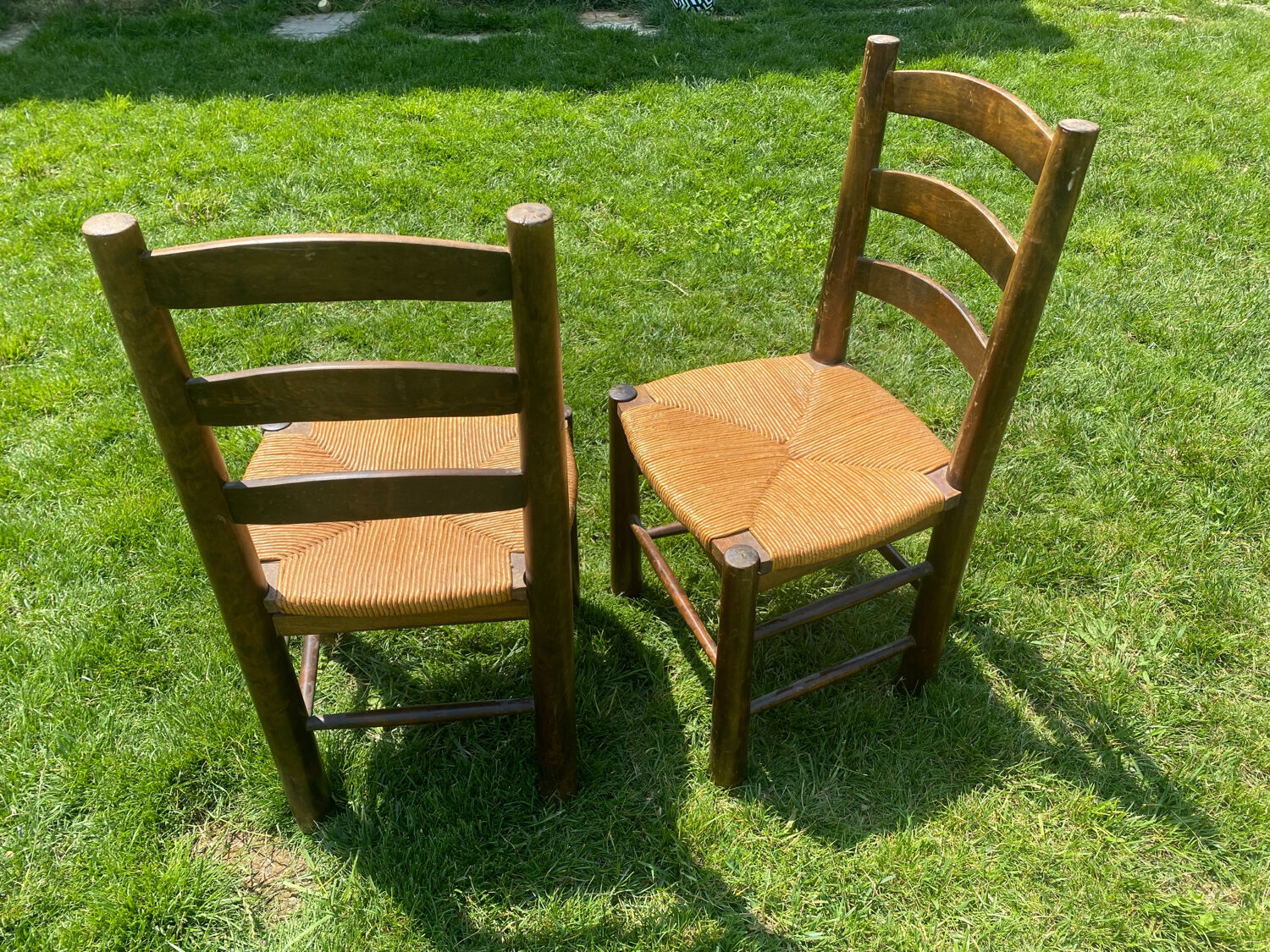Pair of Georges Robert straw chairs