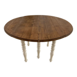 Extendable round table in raw and white wood