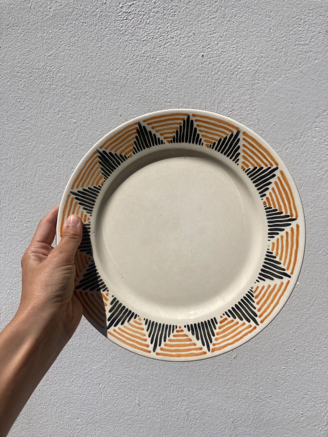 12 flat plates in yellow earthenware Badonviller