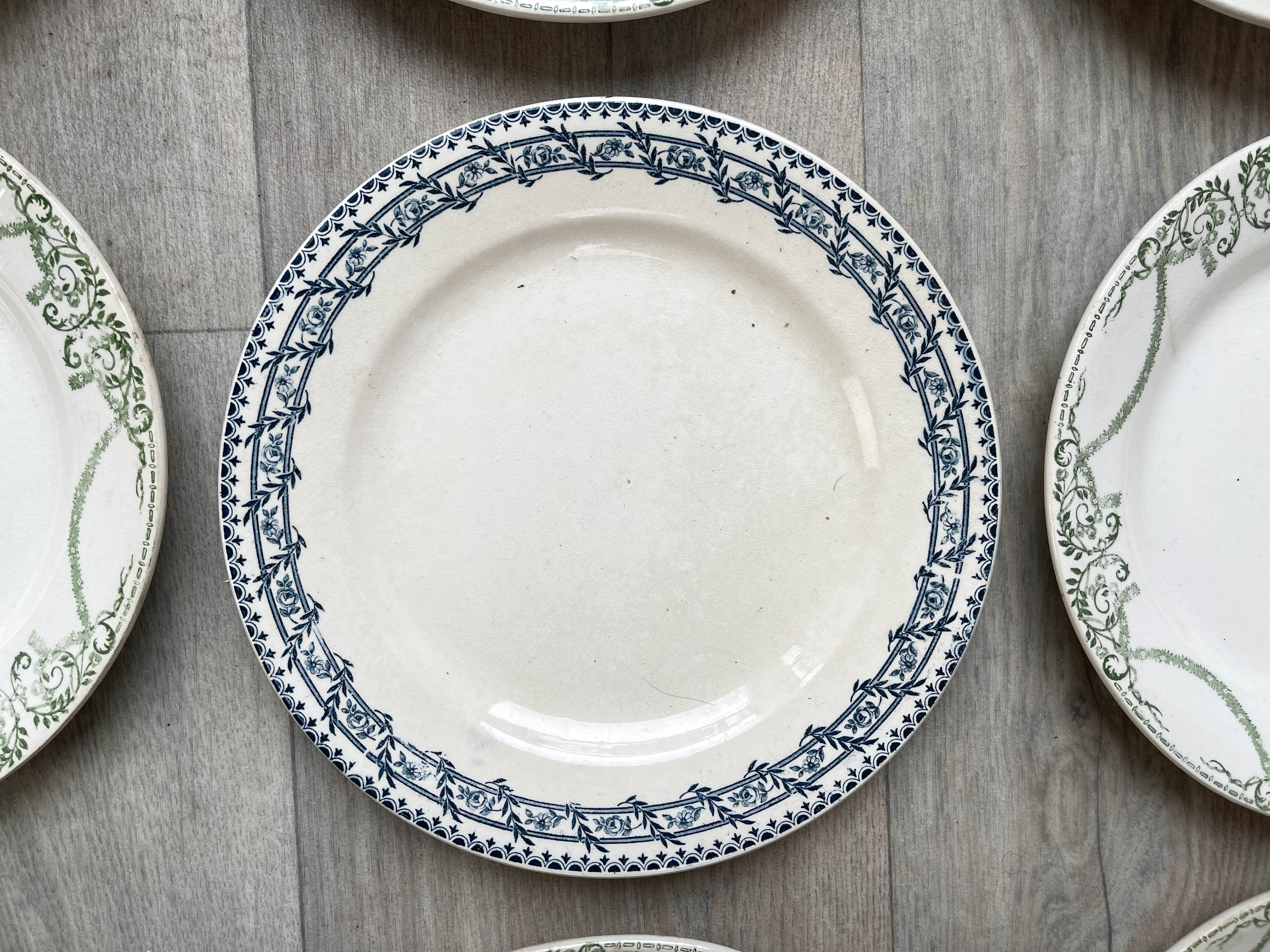 6 green and blue mismatched iron earth plates