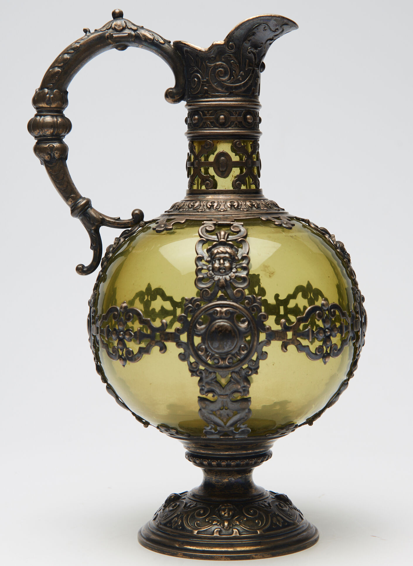 Nineteenth Renaissance style ewer in glass green and brass