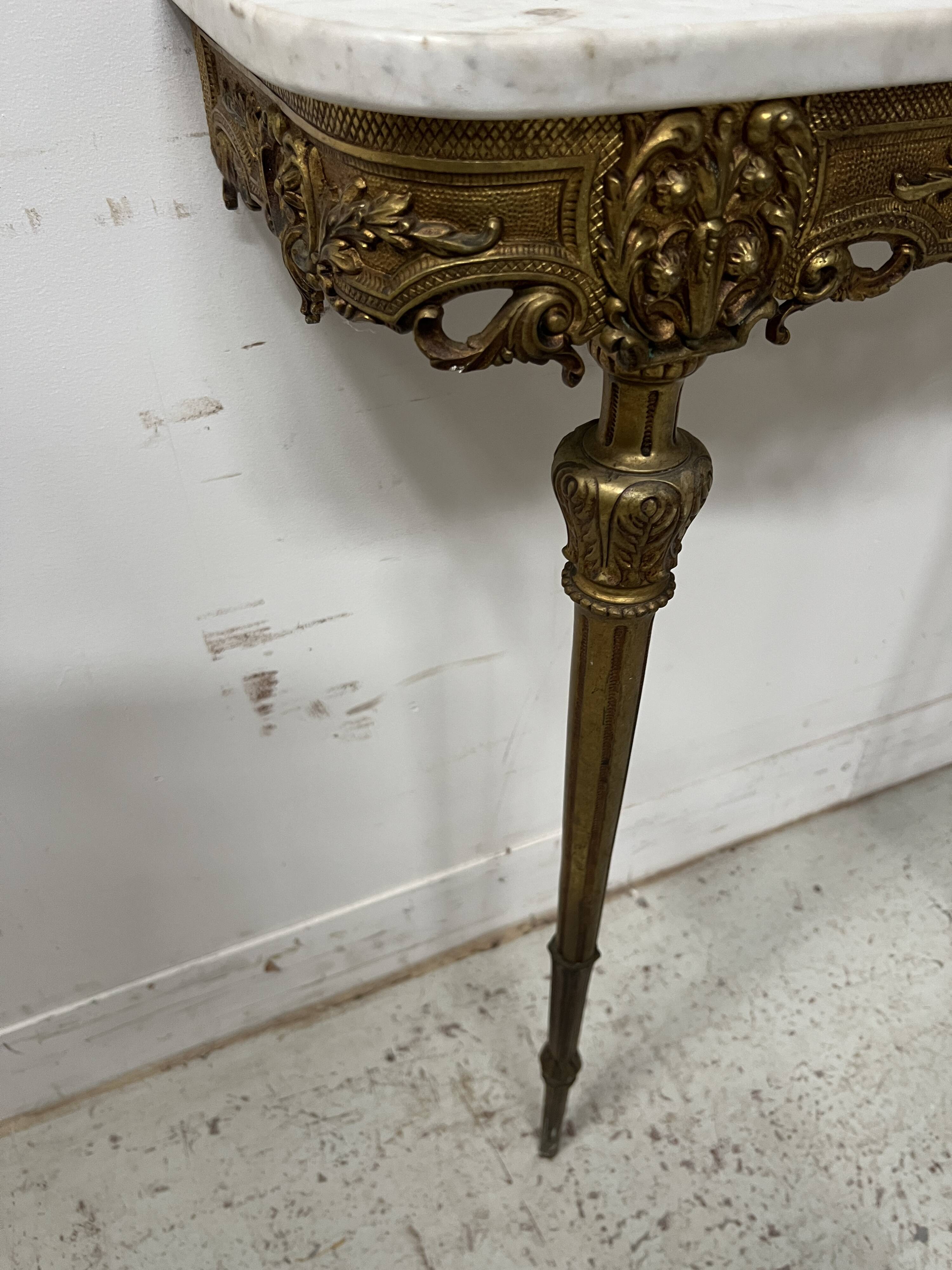 Louis XVI style console in chiselled bronze, 20th century.