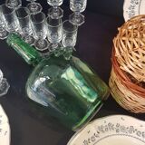 Small bottle style dame Jeanne and its wicker