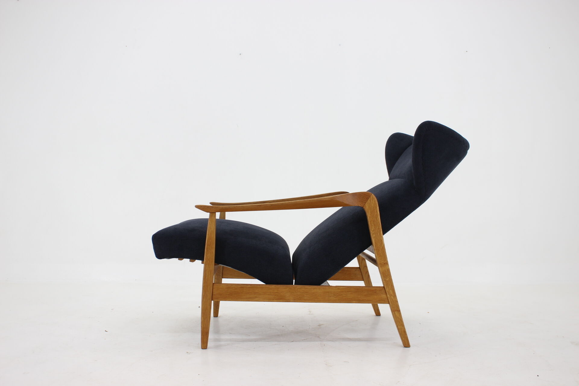 Oak reclining wing chair, czechoslovakia, 1960