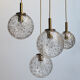 Four gold fleck globe pendants by Doria Germany