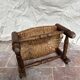 Rustic footrest made of wood and straw