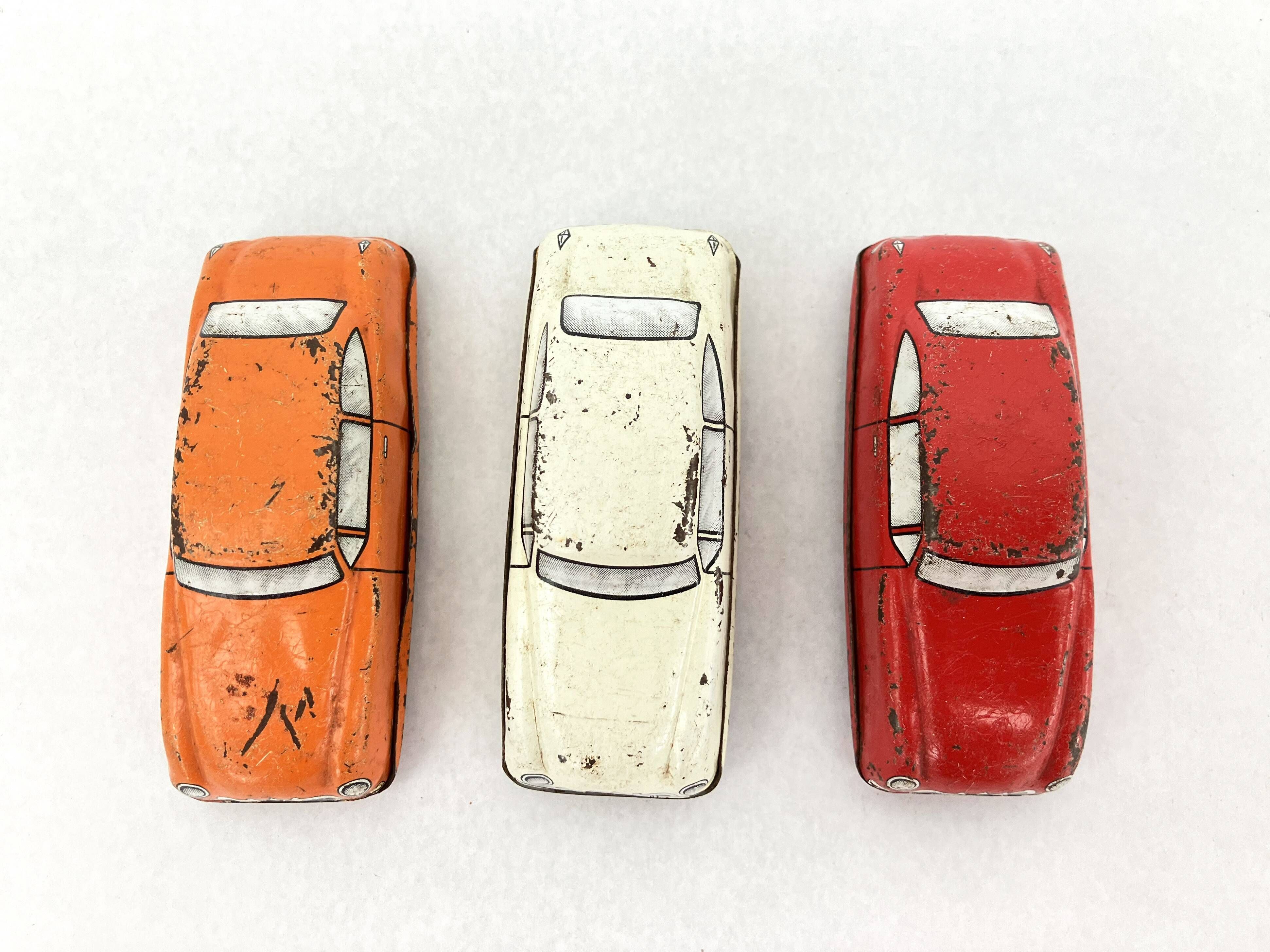 3 old small tin circuit cars with lead wheels • Vintage • 1960s