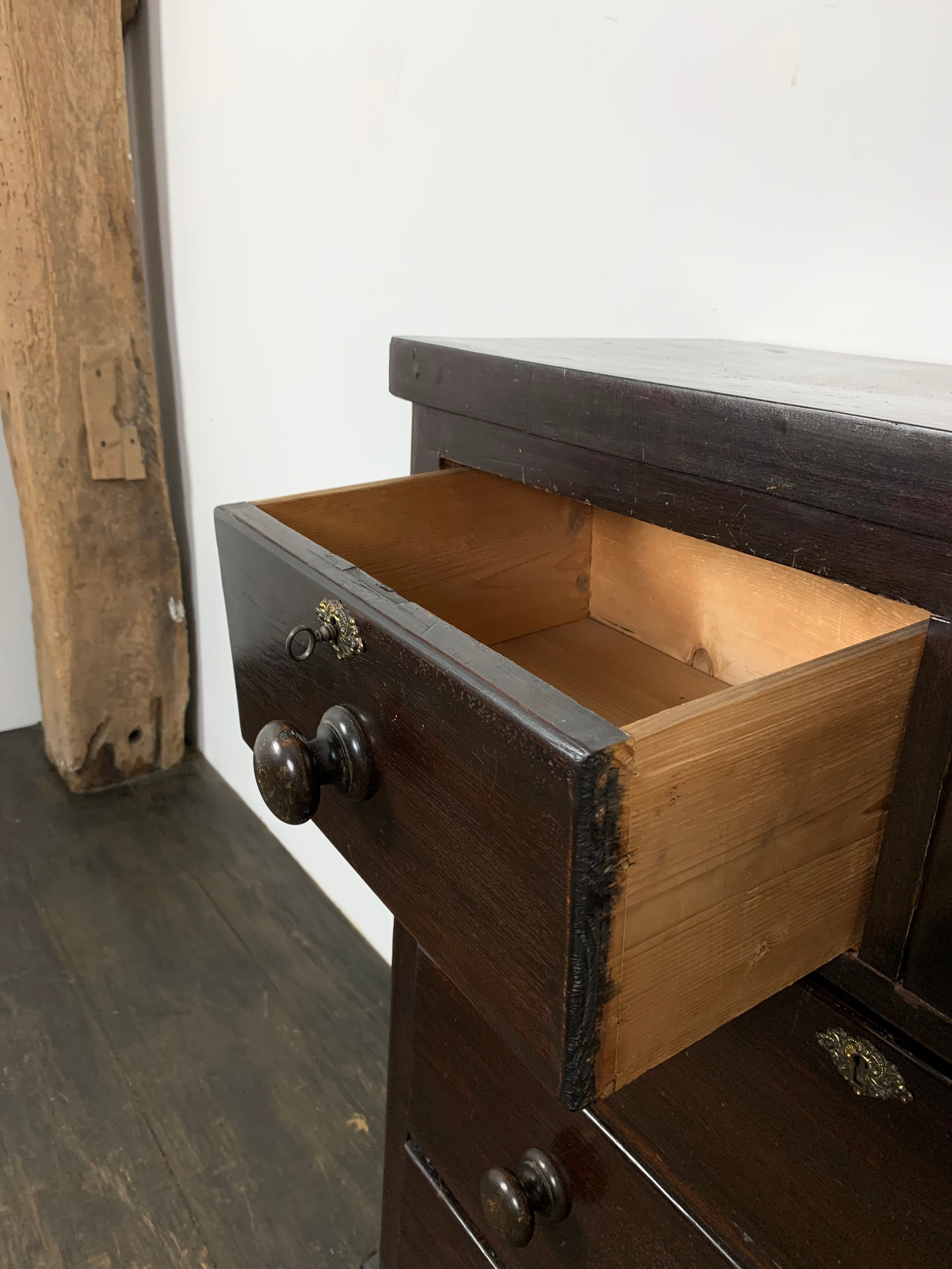 Dark antique chest of drawers