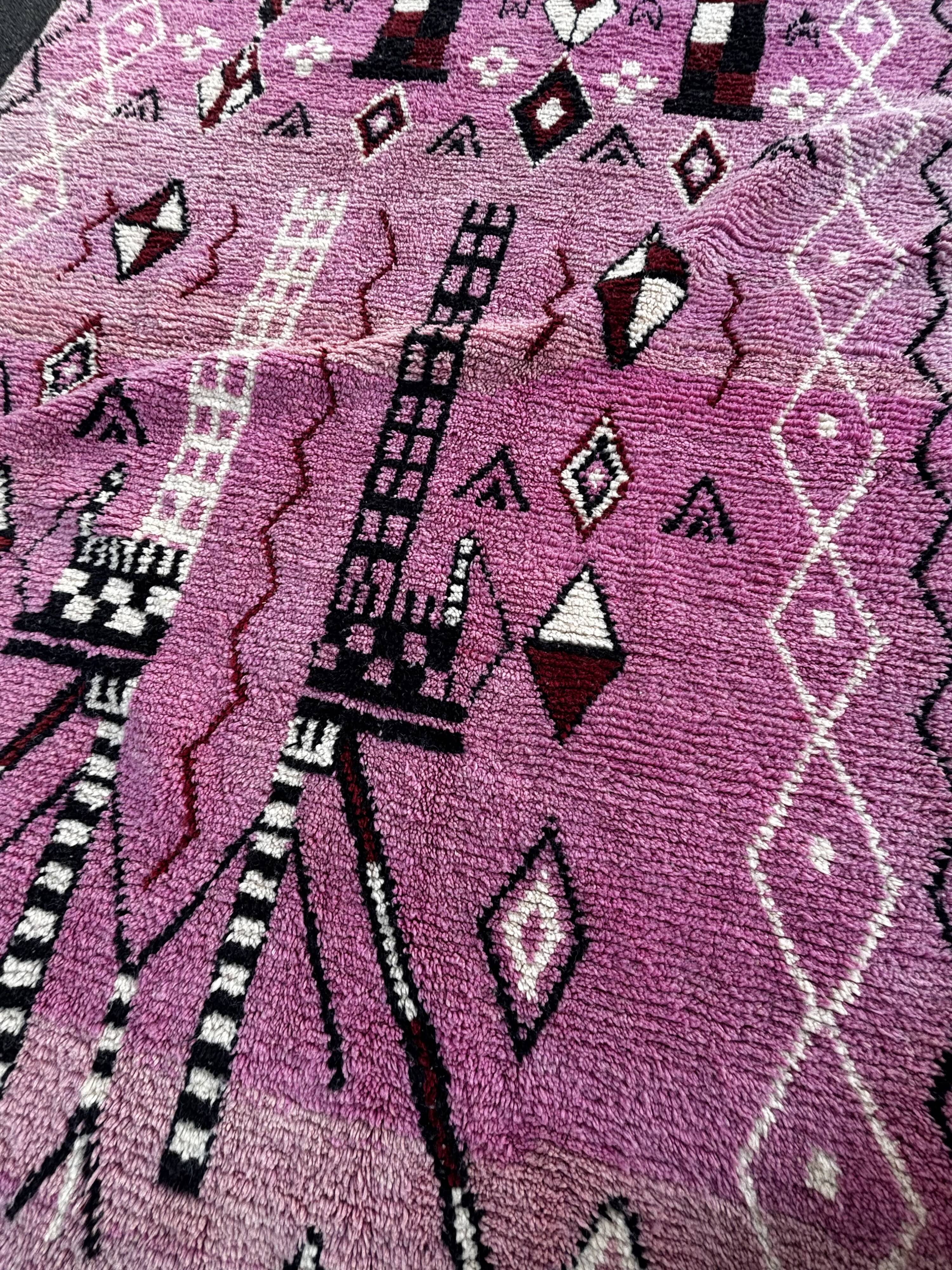Berber Moroccan pink carpet made of wool in Morocco.