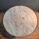 Circular pedestal table with white marble top