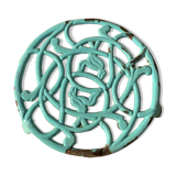 Dessous de plat ancien en fonte émaillée  bleu verte ciselure oiseaux format rond