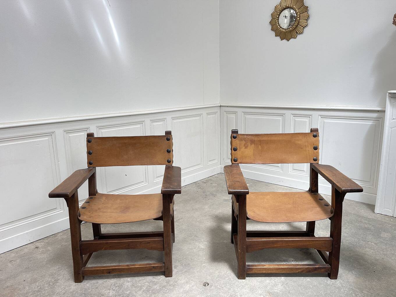 Pair of leather and walnut armchairs from the 1950s