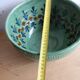 Large glazed ceramic salad bowl with a floral design.
